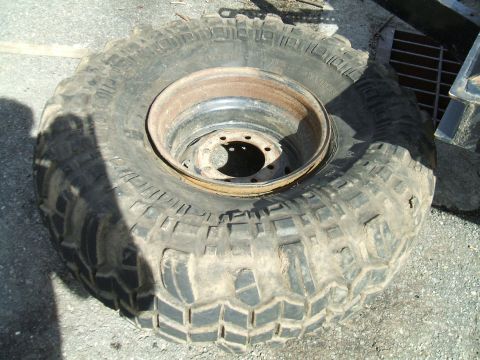 1995 Ford Bronco - This is a single off-road tire and rim, not a 1995 Ford Bronco.