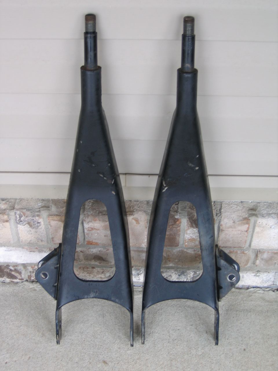 two black control arms