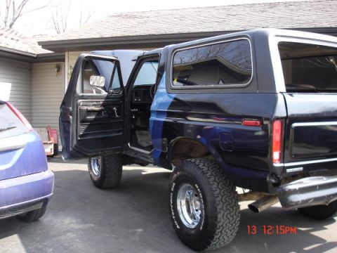 1979 Ford Bronco - This black Ford Bronco, likely a 1978 model, is shown with its doors ajar.