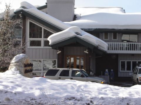 1992 Ford Bronco - SUV parked in front of a snow-covered building during winter.