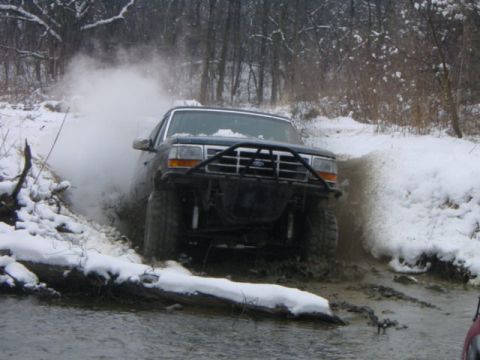 1992 Ford Bronco - blasting through a hole.