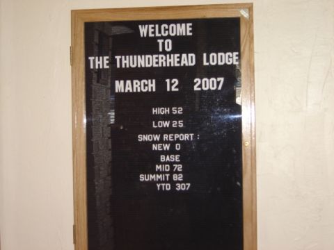 1992 Ford Bronco - Photograph of a ski-lodge letterboard welcome sign with date and snow report, not a technical document.