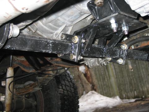 1994 Ford Bronco - Custom brackets are installed on the ZF transmission mount, showing a view of the underside of the vehicle.
