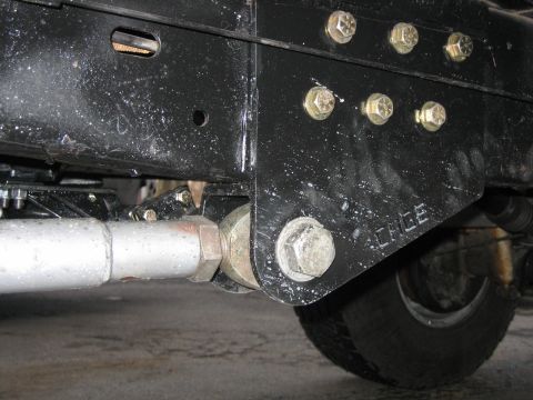 1994 Ford Bronco - Vehicle frame and suspension components with visible stamped text.