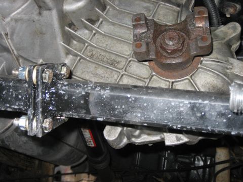 1994 Ford Bronco - Close-up of a transmission housing with visible casting marks and a driveshaft yoke attached.