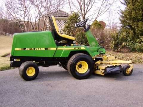 1996 Mercury Grand Marquis - A John Deere F710 lawn tractor is shown from a three-quarter front angle.