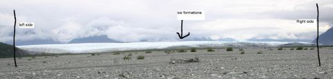2003 Jeep TJ - A vast glacier stretches across the horizon, with mountains shrouded in clouds behind it.