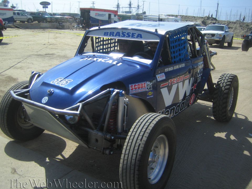 Blue VW-powered off-road buggy number 505 on a dirt lot