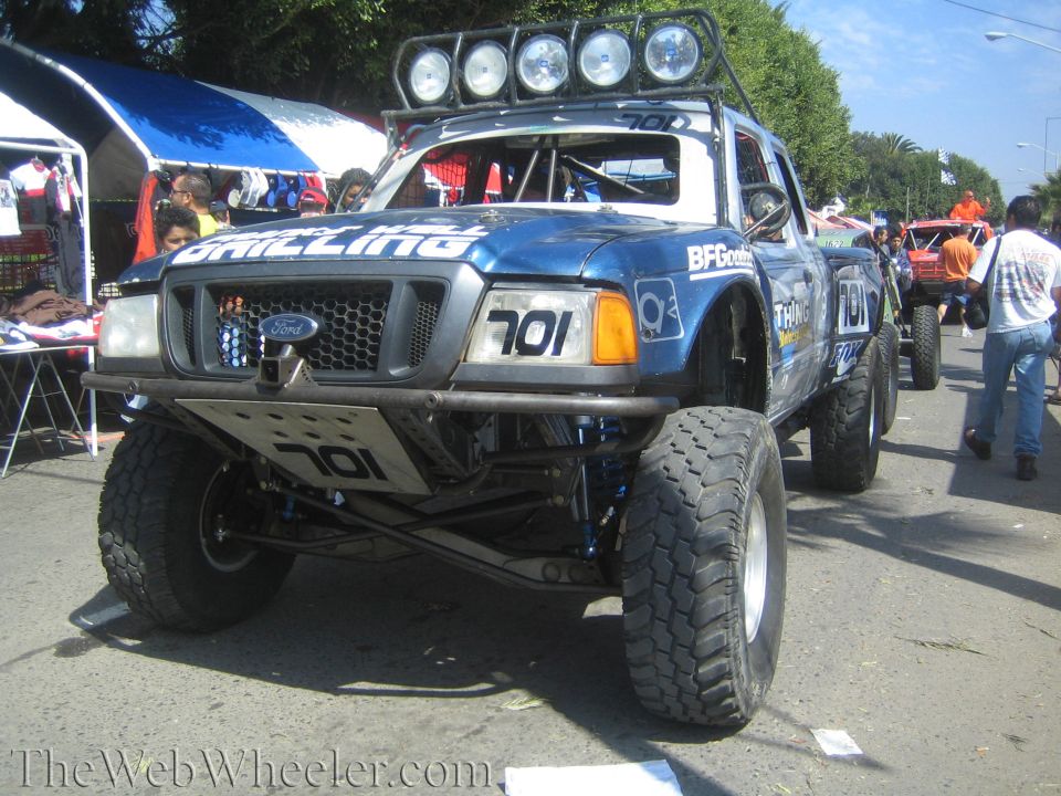 Blue Ford Ranger off-road truck No. 701 with roof lights at sunny event