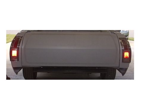 1972 Ford Ranchero - The rear of a pickup truck, possibly a Ford Ranchero, is shown with its brake lights illuminated.