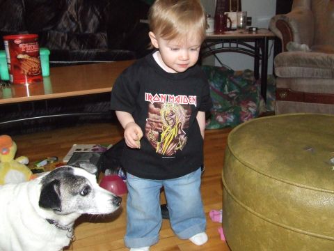 1990 Ford Bronco - A young child and a dog are indoors, with household items visible.