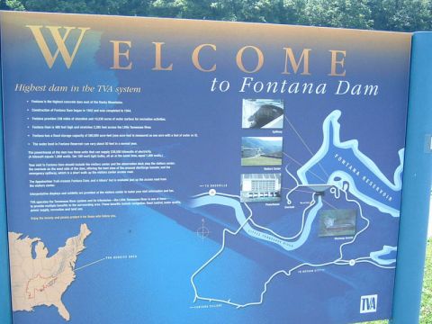 1985 Ford LTD Crown Victoria - Photo of a blue Welcome to Fontana Dam interpretive sign with text facts and a map of the TVA reservoir.