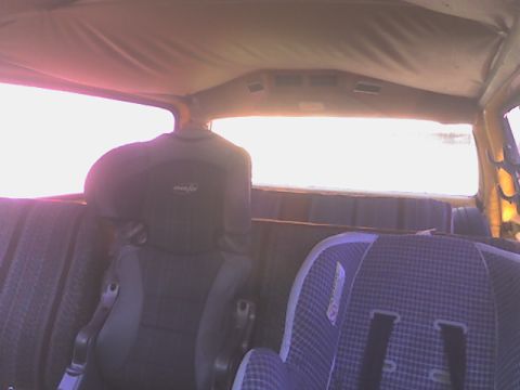 1984 Chevrolet Suburban - View back from the driver's seat, with all seats up and child seats mounted and belted in.