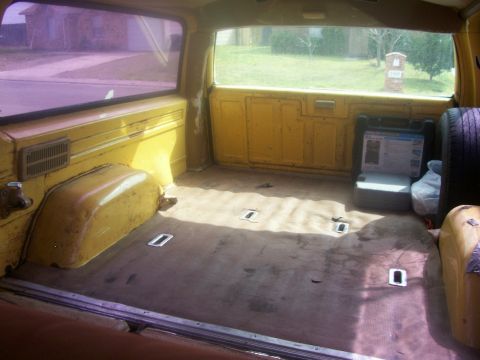 1984 Chevrolet Suburban - View back from the driver's seat with middle seat folded down and third seat removed.