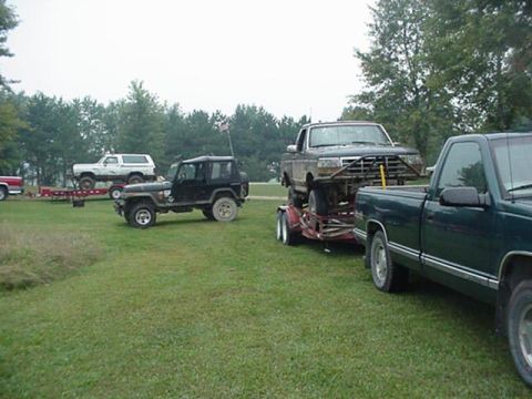 1992 Ford Bronco - all 3 rigs. tonys dodge on his trailer, joes jeep recieving a new tire ,and mine on dummy wheels. doesnt it look funny.