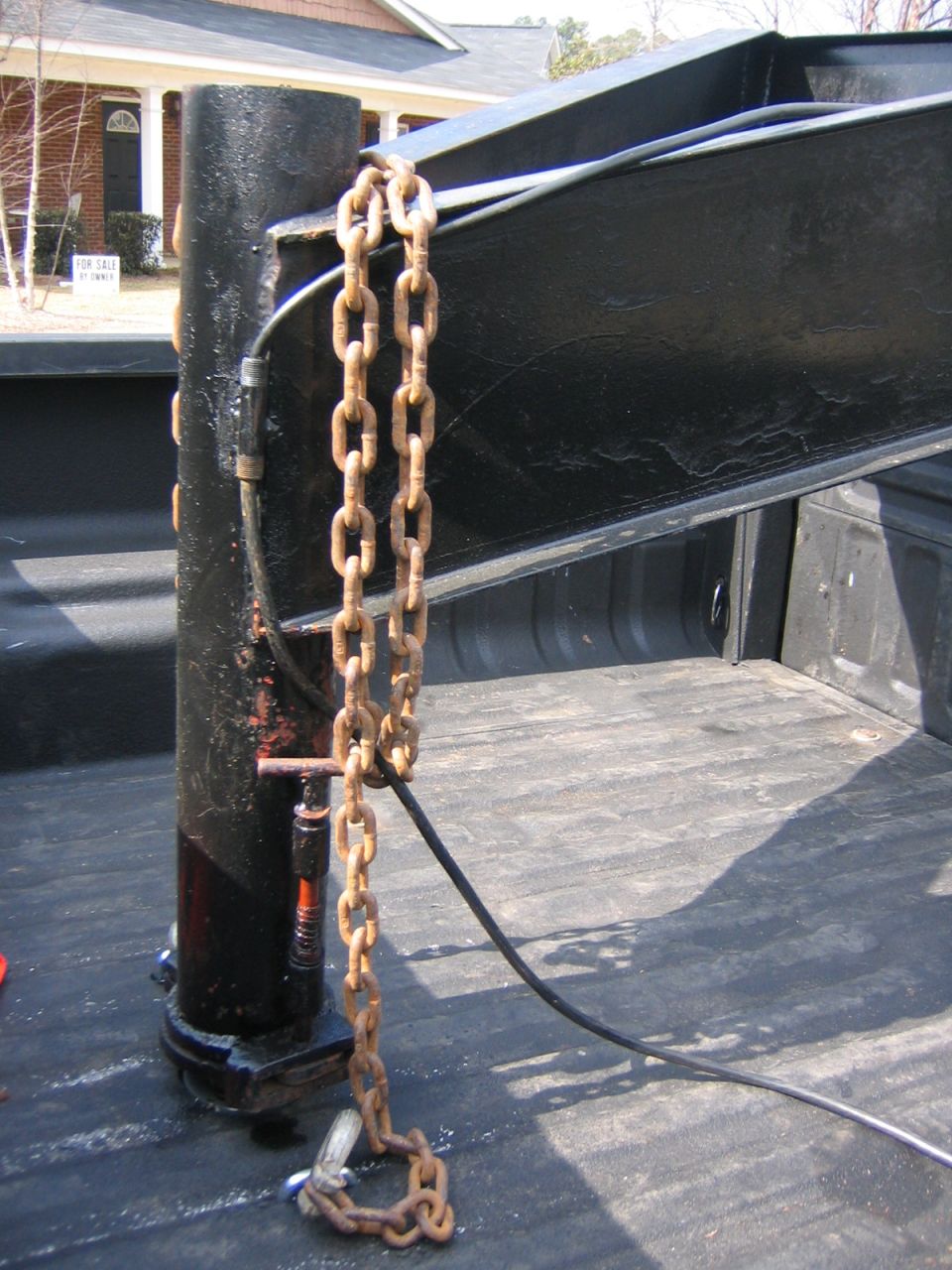 Gooseneck hitch and chains in truck bed