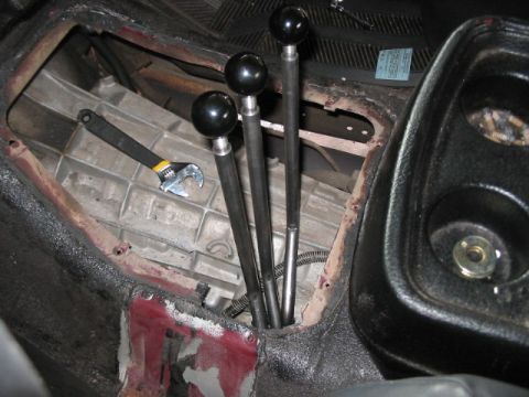 1991 Ford Bronco - Interior view of a manual transmission with shifter levers and a wrench. No year is visible.