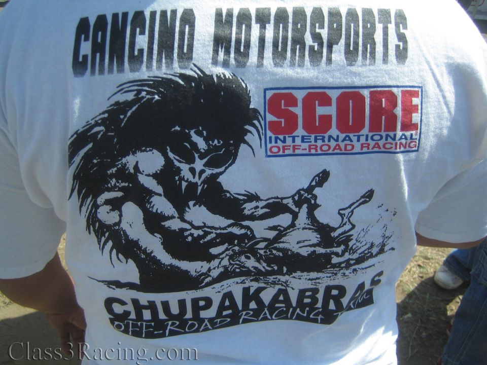 Back of white T-shirt reading Cancino Motorsports Chupakabras and SCORE