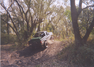 1992 Ford Bronco - this challenging hill. slides you into a tree. it got me this time!