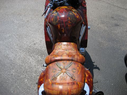 1986 Ford Bronco - Custom painted motorcycle seat and fuel tank with pirate-themed artwork and text.