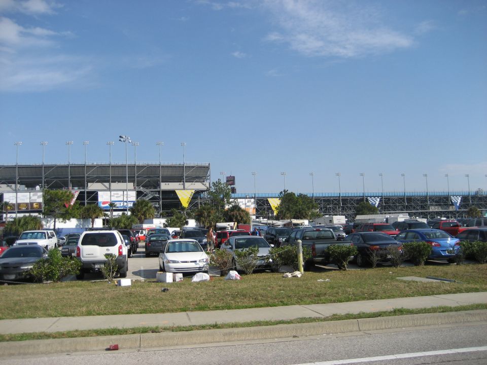 Parking lot with stadium in background