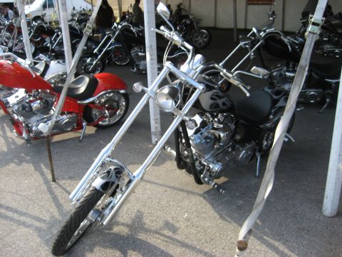 1986 Ford Bronco - Several custom motorcycles are parked together, some with elaborate paint jobs and chrome accents.