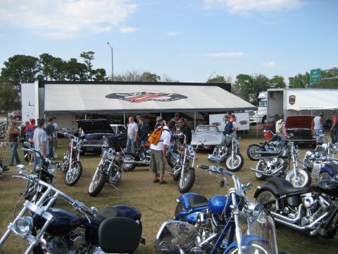 1986 Ford Bronco - A sunny day event features a variety of motorcycles on display with attendees observing the vehicles.