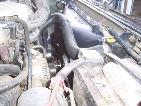1994 Ford F-150 - Close-up of a vehicle's engine bay, focusing on the radiator and fan assembly.