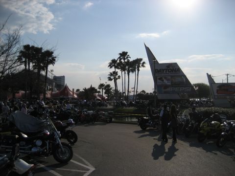 1986 Ford Bronco - Motorcycles fill the parking area at Daytona International Speedway during an event.