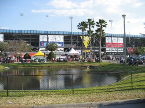 1986 Ford Bronco - A view of Daytona International Speedway during an event, with tents and palm trees in the foreground.