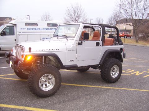 2002 Jeep Wrangler - This modified Jeep Wrangler appears to be from the early 2000s, not a 2002 model as claimed.