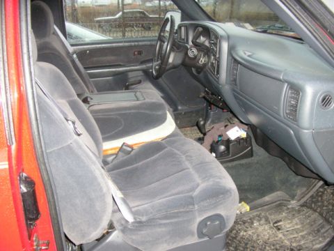 1994 Ford Probe - Interior of a red truck, front seats and dashboard.