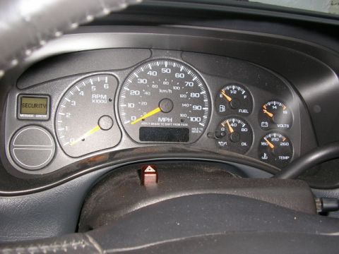 1994 Ford Probe - The vehicle's interior dashboard displays various gauges and a security message center.