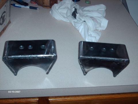 1990 Ford F-150 - Two metal brackets are shown on a counter, with a date stamp of 03/15/2007.