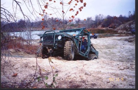 1992 Ford Bronco - conquering a rocky/sandy hill. very tight fit on the other side. wedged it between a few rocks