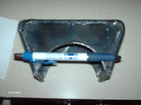 1990 Ford F-150 - A metal bracket is shown with a pen for scale. The date 03/15/2007 is visible in the corner.