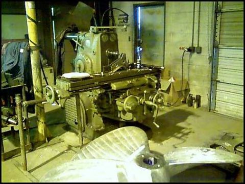 1996 Ford F-150 - Workshop scene with a milling machine and various metal parts in the foreground.