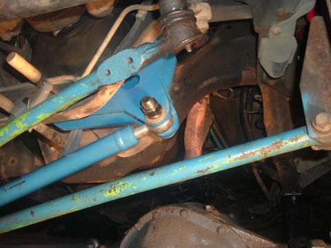 1996 Ford F-150 - Close-up of the steering and suspension system components underneath a vehicle.