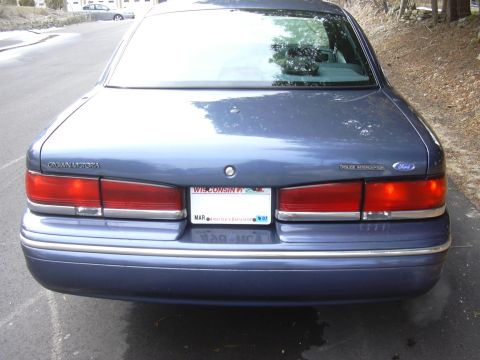 1996 Ford Crown Victoria - Rear view of a blue 1996 Ford Crown Victoria, showing its taillights and license plate.