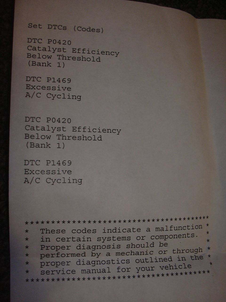 Printed list of set DTCs P0420 Catalyst Efficiency Below Threshold (Bank 1) and P1469 Excessive A/C Cycling