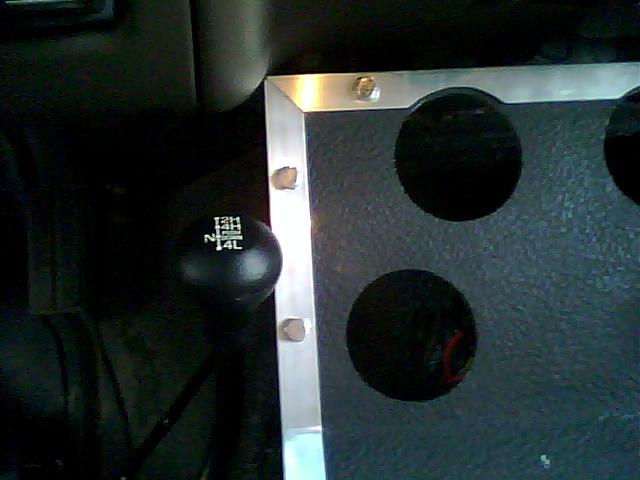 4x4 shifter with 2H, 4H, N, 4L markings and dashboard panel with circular cutouts