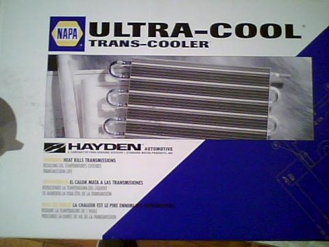 1995 Ford Bronco - The photo shows the packaging for a NAPA Ultra-Cool transmission cooler, the product and its benefits.