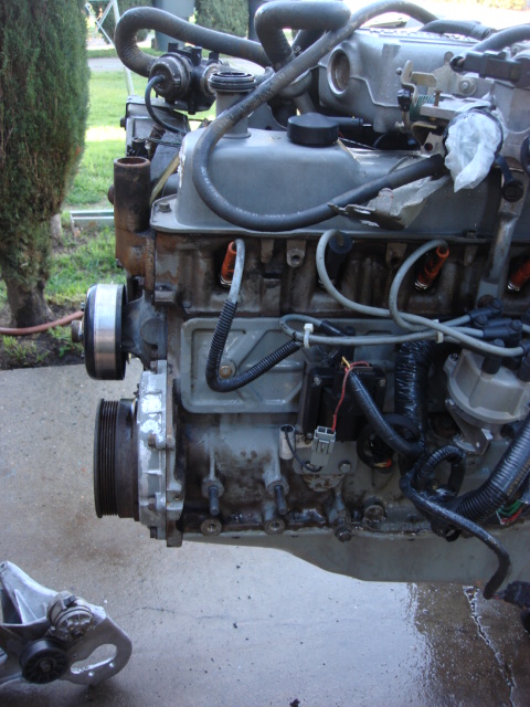 1983 Ford Bronco - here is the motor with the bracket removed. i need to clean the motor some more..