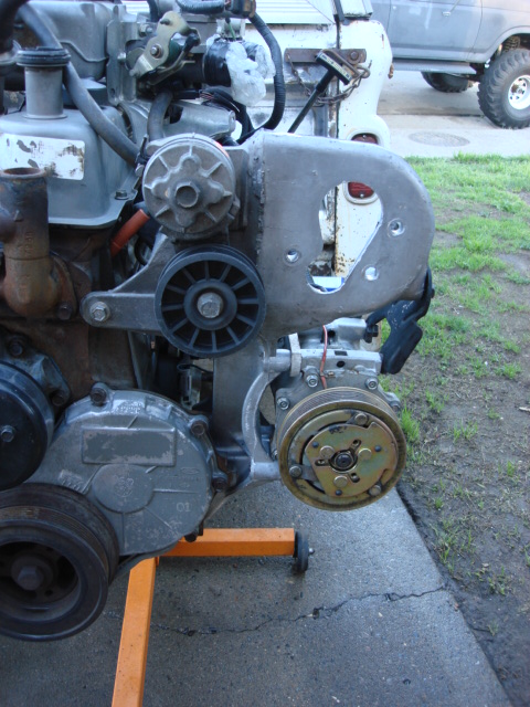 1983 Ford Bronco - the new mount is in place and the old AC compressor and spacers are installed.