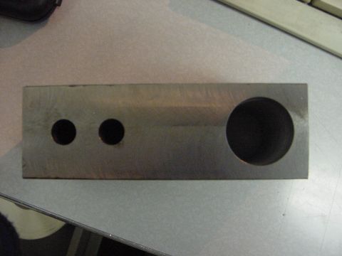 1994 Ford Bronco - A metal component with drilled holes is shown, unrelated to the claimed vehicle year or model.
