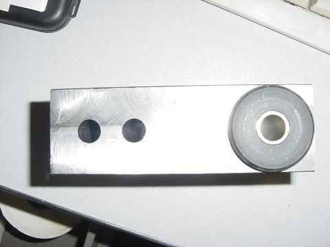 1994 Ford Bronco - This is a metal component two drilled holes and a rubber bushing on one end.
