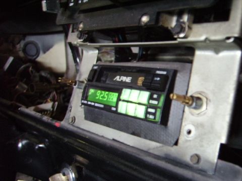 1978 Ford Bronco - An aftermarket Alpine stereo is installed in the dashboard of a vehicle, displaying the radio frequency '92.5'.