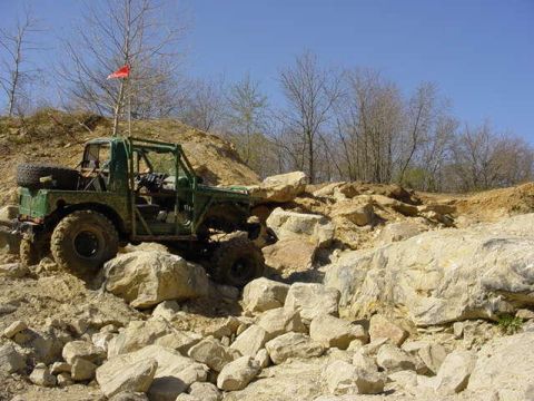 1992 Ford Bronco - This off-road vehicle is shown traversing a challenging rocky landscape.