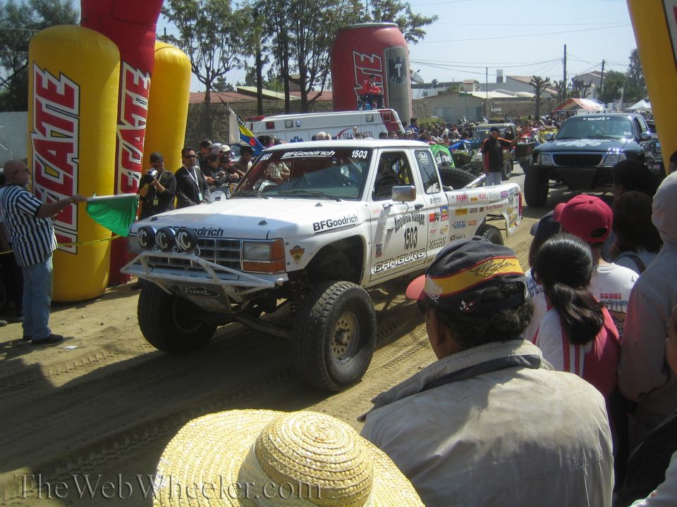 White off-road race truck no. 803 with light bar and BFGoodrich livery
