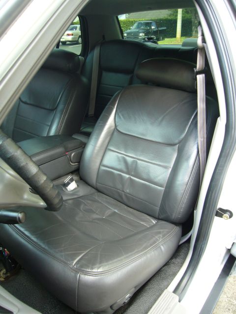 2000 Ford Crown Victoria - Interior view of the front and rear leather seats within a 2000 Ford Crown Victoria.